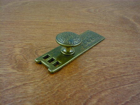 old brass anviled backplate w/round button knob