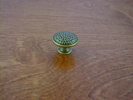 antique brass anviled top round button knob